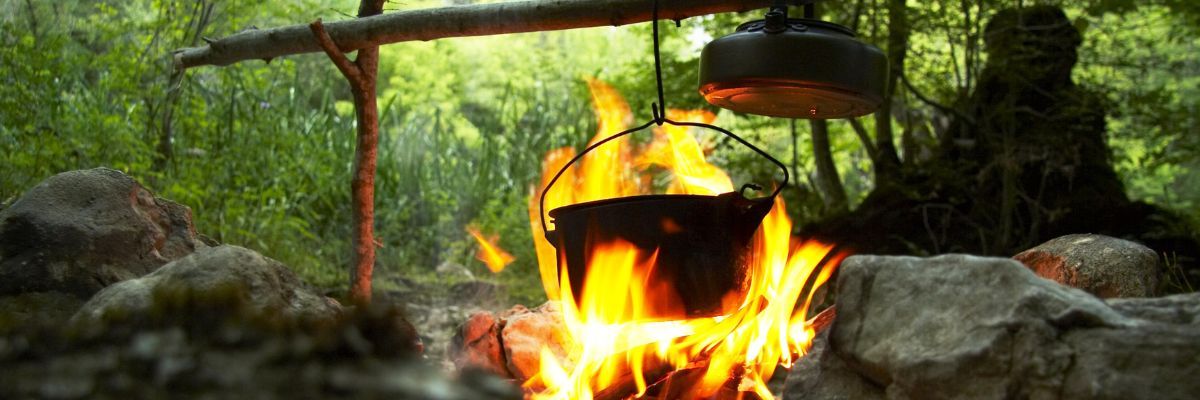 Camping Cooking over a fire